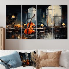 a living room with three paintings on the wall