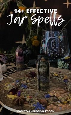 a table topped with candles and bottles filled with flowers