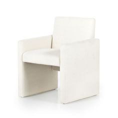 a white chair sitting on top of a white floor