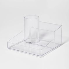 a clear plastic container with a cup on top