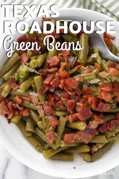 a white bowl filled with green beans and bacon