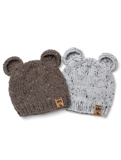 two knitted hats with ears on top of each other, one grey and one brown