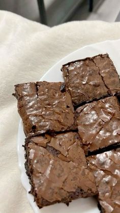 some brownies are on a white plate