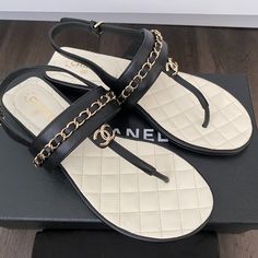 2023 Chanel Cc Logo Black Thong Leather Flat Shoes Sandals Size 37. Brand New In Box With Dust Bag. Luxury Leather Flip Flops With Single Toe Strap, Luxury Leather Open Toe Flip Flops, Luxury T-strap Sandals With Single Toe Strap, Designer Sandals With Cushioned Footbed And Single Toe Strap, Designer Leather Flip Flops For Summer, Designer T-strap Sandals With Leather Sole, Luxury Leather Flip Flops For Beach, Luxury T-strap Sandals With Leather Sole, Luxury Leather Toe Post T-strap Sandals