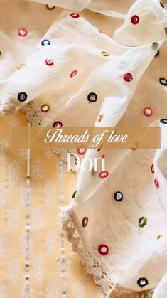 an image of the words threads of love doi on top of a bed sheet