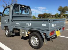 a gray truck parked in a parking lot