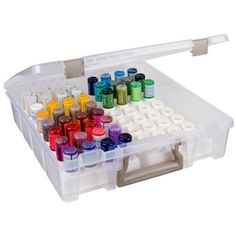 a large plastic container filled with lots of different colored inks and markers in it