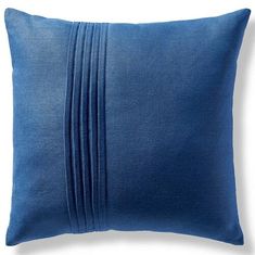 a blue pillow with pleated edges