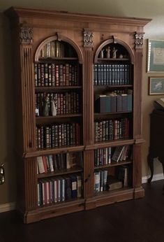 an old bookcase with many books in it