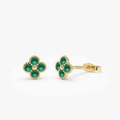 Delight in the charm of our 14K solid gold Emerald Clover Studs, showcasing exquisite emerald flower clovers. These petite earrings bring an air of refinement to any ensemble, suitable for daily wear or noteworthy events. They serve as a meaningful present, embodying luck and grace through their enduring style and vivid emerald highlights. Features * Gold KT: 14K Solid Gold * Custom Gold Color: Rose Gold, Yellow Gold, White Gold * Length & Width: 6.45 MM x 6.45 MM * Round Sapphire: 8 pcs 2.0 MM  * Total CTW: 0.30ctw * Ready to Ship in 1-2 Business Days ▶ See more of our Ruby Jewelry - https://etsy.me/3XbNleY ▶ See our storefront here - http://etsy.me/2lUcVnH  ▶ All store sections here * Diamond Rings - http://etsy.me/2lwKUl8 * Diamond Earrings - http://etsy.me/2lyqVBP * Diamond Necklace - Emerald Highlights, Beaded Studs, Emerald Studs, Petite Earrings, Round Sapphire, Gold Armband, Clover Earrings, Earrings Dainty, Ruby Jewelry