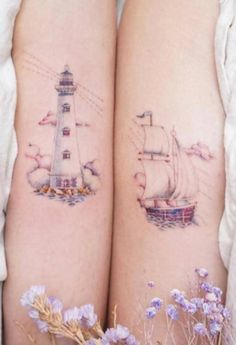 two people with tattoos on their legs and one has a boat in the water next to them