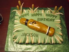 a birthday cake made to look like a baseball bat