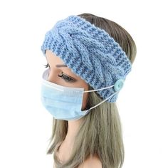 a mannequin wearing a blue knitted headband with a face mask on it