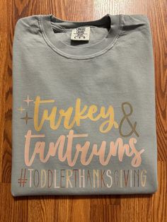 You have found the PERFECT casual Thanksgiving tee for you AND your mama bestie! The shirts used are the Comfort Colors brand (Color: Bay). These tees are unisex, but I would recommend ordering your normal size. If you want a tighter fit I would recommend sizing down. Washing Instructions: -wash inside out -machine wash in cold water -do not bleach -do not dry clean -iron inside out -tumble dry at low heat Mommy And Me Thanksgiving Shirts, Fall Crew Neck T-shirt With Name Print, Thanksgiving Shirts For Kids, Thanksgiving Shirt Ideas, Toddler Thanksgiving Shirt, Toddler Thanksgiving, Fall Funny, Kids Thanksgiving, Thanksgiving Tee