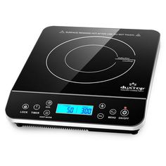 a black and silver electric cooktop on a white surface with the timer displayed at the top