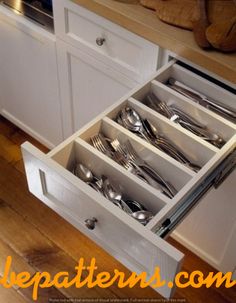 an open drawer with silverware in it and the words make so much more sense, and looks infinitely better than those plastic dividers