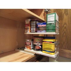 an organized pantry with canned food and condiments