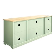 a green dresser with four drawers and two black dots on the bottom drawer, in front of a white background