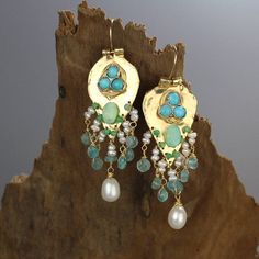 Turquoise Statement Earrings, Something Blue, Gold Filled Gemstone Earrings, Turquoise Earrings, Unique Gift for Mom, Birthstone EarringsTurquoise Sherazade earrings are made of organic gold filled shaped like a knight shield set with three natural turquoise gemstones.The earrings have a strong spiritual meaning and meant to protect its wearer.A unique setting of bezel set turquoise gemstones on the gold filled shield, and a beautiful handwoven cluster of pearls, apatite, jade and Peruvian pearl Turquoise Drop Earrings With Gemstone Accents, Turquoise Gemstone Drop Earrings, Turquoise Pearl Dangle Earrings, Turquoise Teardrop Pearl Drop Earrings, Handmade Turquoise Earrings For Anniversary, Handmade Turquoise Earrings For Wedding, Teardrop Multi-stone Earrings For Wedding, Teardrop Multi-stone Wedding Earrings, Turquoise Dangle Earrings With Gemstone Accents