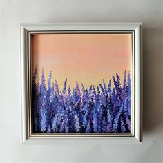 a painting of purple flowers on a white wall