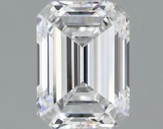 an emerald cut diamond on a gray background