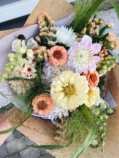 a bouquet of flowers sitting on top of a table