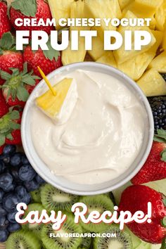 a bowl of fruit dip surrounded by sliced kiwis, strawberries and grapes