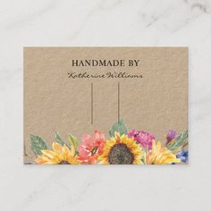 a business card with sunflowers and leaves on the bottom, which reads handmade by