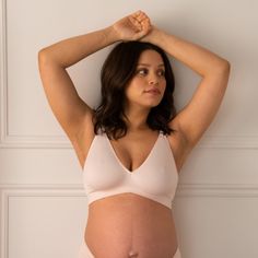 A plunge bra that gives you the look without the wire. The V-Neck Maternity & Nursing Bra is sustainably made with a single layer of stretchy recycled nylon for gentle support in a soft and lightweight style. Beautifully detailed with a low v-neckline and crossover band that embraces a pregnant belly. It's an uncomplicated design with an intuitive fit for the many adventures with baby to come. Pink Stretch V-neck Bra, Soft Touch Stretch V-neck Bra, Fitted Seamless Nursing Bra With V-neck, Low-cut Fitted Nursing Bra With Soft Touch, Fitted Low-cut Nursing Bra With Soft Touch, V-neck Stretch Bra With Soft Touch, Soft Touch Fitted Low-cut Nursing Bra, Fitted V-neck Bra With Soft Touch, Stretch Pink V-neck Bra