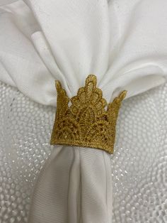 a white cloth with a gold crown on it