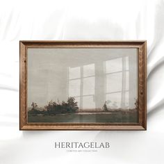 there is a painting hanging on the wall in front of a white sheet that says heritage lab