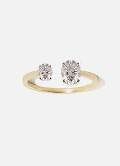 Crafted of polished 18k gold, our Mommy+Me Oval Diamond Ring showcases a Mommy diamond (7x5mm) and Baby diamond (6x3mm ) Timeless Oval Diamond Anniversary Ring, Hand Set Oval Diamond Ring Gift, Oval Diamond Ring For Anniversary, Brilliant Cut Oval Rings, Oval Diamond Ring Gift, Classic Oval Rings, Modern Oval Diamond Ring As Gift, Modern Oval Jewelry For Anniversary, Oval Cubic Zirconia Rings