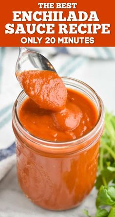 a spoon full of sauce sitting on top of a table next to lettuce