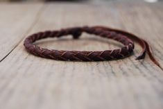 - BRAIDED LEATHER WRISTBAND - BRACELET FOR WOMEN, MEN AND CHILDREN - Ideal for active people, this classic leather bracelet made with round braiding is hand-woven to obtain a bracelet that combines perfectly with everything.  Discreet and light, it is made with top quality leather that withstands water and the passage of time very well, adapting perfectly to the shape of the wrists of adults and children. Adjustable to any wrist and ankle size, it is an ideal gift for all family members. ⤛ Featu Adjustable Brown Leather Bracelet, Handmade Rustic Braided Bracelets As Gift, Rustic Handmade Braided Bracelets For Gifts, Rustic Handmade Braided Bracelets As Gift, Rustic Handmade Braided Bracelet Gift, Round Bracelet, Brown Leather Bracelet, Simple Gift, Bracelet Simple