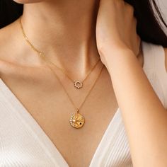 Enhance your everyday look with the Gold Leah Necklace. This delicate and dainty necklace features a sparkly round charm, perfect for layering and stacking to add a touch of glamour to any outfit. Elevate your style with ease and upgrade your jewelry collection today. …………………………………. D E T A I L S• Materials: Stainless steel, 18K gold plating• Length: 40cm (16 inches) + extender 5cm (2 inches)• Charm Diameter: 1.0cm• This product is hypoallergenic, waterproof and tarnish resistant Trendy Layered Necklace With Delicate Chain, Trendy Round Clavicle Chain Charm Necklaces, Delicate Round Charm Necklace For Everyday, Everyday Delicate Round Coin Necklace, Trendy Round Charm Necklaces For Everyday, Trendy Everyday Round Charm Necklaces, Elegant Everyday Charm Necklace With Coin Pendant, Trendy Round Pendant Charm Necklaces For Everyday, Dainty Coin Pendant Necklaces For Layering