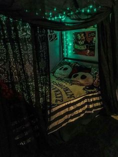 a bed with lights on it in a room that looks like someone's bedroom