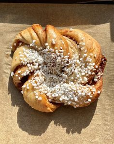 a pastry with white sprinkles on it