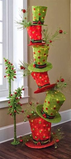 a group of hats that are on top of each other in front of a window