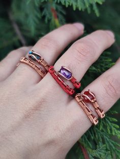 This ring combo is made of 3 handmade wire-wrapped copper rings: - Red agate ring - Purple glass red ring - Abalone shell ring These rings are all adjustable and made from 2 types of copper, raw and varnished. -Tarnish-proof and won't leave green marks on your finger. -To clean, dip the ring for 5 seconds in a mixture of vinegar and salt, then rinse with water and dry well. -suggested not to swim or shower with the rings on regardless. *These rings are sold as a set, you will get all 3 if purchased. Check these listings out: Red agate necklace: https://www.etsy.com/listing/1474737144 Amethyst necklace: https://www.etsy.com/listing/1387983713 Other rings set: https://www.etsy.com/listing/1661783772 Have any questions? Be sure to message me :) Check out my Instagram profile: @bronzaii.jewelr Unique Adjustable Crystal Ring, Unique Adjustable Crystal Ring In Metal, Unique Adjustable Metal Crystal Ring, Handmade Metal Stackable Rings For Jewelry Making, Adjustable Copper Wire Wrapped Rings, Adjustable Nickel-free Copper Ring, Bohemian Adjustable Crystal Ring For Gifts, Bohemian Adjustable Crystal Ring As Gift, Adjustable Copper Nickel-free Rings