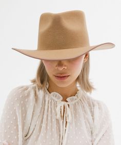 Watch out western trends -- the June Teardrop Rancher is a felt Western hat with our own modern twist. Featuring a teardrop-shaped crown paired with an angled Western brim, this western inspired silhouette is ready to accompany you from countryside to the town. Bound with a tonal grosgrain ribbon around the brim edge for added detail. Bands shown are sold separately HERE! Western Style Fitted Felt Hat, Fitted Fur Felt Hat For Ranch, Western Wool Hat Bands, Western Fur Felt Fedora For Spring, Western Style Fur Felt Fedora For Spring, Fitted Fedora For Rodeo, Fitted Felt Hat For Rodeo In Fall, Elegant Winter Felt Hat For Ranch, Fitted Felt Hat For Rodeo