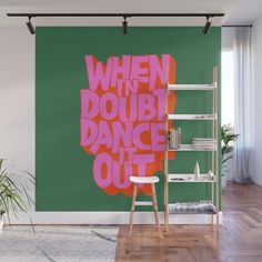 a wall mural with the words when the doubt dance out in pink on green background