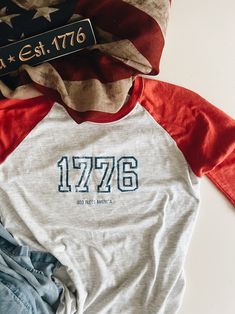 USA AMERICA PATRIOTIC Womens Tee Shirt 1776 God Bless America - Etsy College Raglan Sleeve T-shirt With Letter Print, Letter Print Raglan Sleeve T-shirt For College, God Bless America, Womens Tees, Tee Shirts, Graphic Tees, Bathing Beauties, Tops & Tees, Adult Outfits