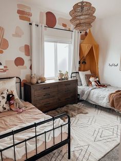 Two beds in a kids bedroom Boho Sibling Bedroom, Co Ed Room Shared Bedrooms, Boho Bedroom 2 Twin Beds, Shared Girl And Boy Room, Kids Small Shared Bedroom, Co Ed Bedroom Kid Rooms, Shared Gender Bedroom, Earthy Kids Bedroom, Girl Boy Shared Bedroom