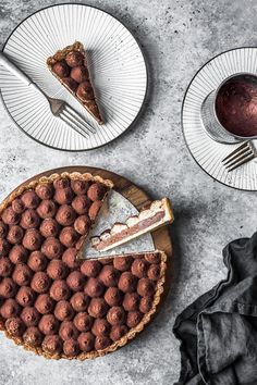 two plates with desserts on them, one has a slice missing from the pie