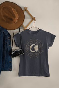 Discover the magic of the cosmos with our stunning t-shirt design featuring the sun and moon. Our unique design captures the beauty of the sky, showcasing the radiant sun and serene moon in perfect balance. Made from high-quality materials and available in a range of sizes, our t-shirt is comfortable, durable, and perfect for everyday wear. Whether you're a lover of astronomy, a spiritual seeker, or simply someone who appreciates beautiful design, our sun and moon tee is the perfect choice. Wear Moon Print Relaxed Fit Crew Neck T-shirt, Relaxed Fit Short Sleeve T-shirt With Moon Print, Cotton Graphic Tee With Moon Print, Celestial Cotton Tops For Summer, Celestial Moon Print Crew Neck T-shirt, Celestial Style Graphic T-shirt For Summer, Celestial Graphic Print T-shirt For Summer, Celestial Crew Neck Tops For Summer, Celestial Short Sleeve Tops With Moon Print