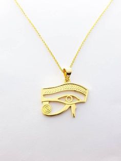 Eye of Horus Gold Necklace, 14k Gold Vermeil Over Sterling Silver Eye Necklace, Egyptian Jewelry.Eye of Horus, in ancient Egypt, a symbol representing protection, health, and restoration.According to Egyptian myth, Horus lost his left eye in a struggle with Seth. The eye was magically restored by Hathor, and this restoration came to symbolize the process of making whole and healing. For this reason, the symbol was often used in amulets.• Material: Eye Of Horus necklace is handcrafted using premi Gold Ancient Style Engraved Necklace, Ancient Style Engraved Yellow Gold Necklaces, Ancient Style Gold Engraved Necklace, Ancient Style Engraved Gold Necklace, Symbolic 14k Stamped Pendant Jewelry, Ancient Gold Pendant Jewelry, Ancient Style Gold Pendant Jewelry, Symbolic 14k Gold Necklaces, Gold Pendant Jewelry In Vintage Style