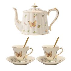 three cups and saucers with butterflies on them