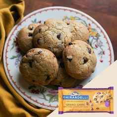 chocolate chip cookies on a plate next to a bag of ghirardella