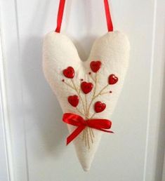 a heart shaped decoration hanging from a door