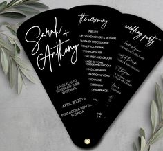 three black and white wedding program fan shaped like an airplane with the names of their guests